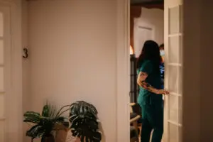 Staff member enters room to see patient who is using acupuncture for constipation