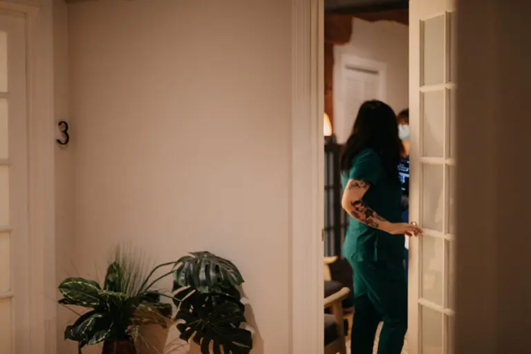 Staff member enters room to see patient who is using acupuncture for constipation