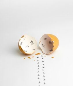 Acupuncture for low AMH? This image shows hash marks inside a broken eggshell, with tiny chicken foot prints walking away from the eggshell. This here is meant to demonstrate all the long days spent waiting while trying to get pregnant.