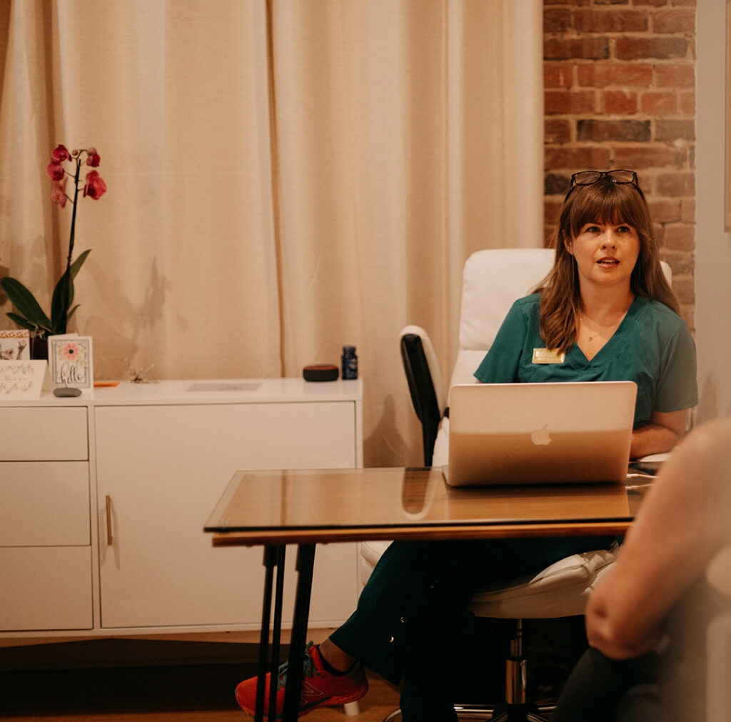 Patient consults with Maegan Hodge, acupuncturist in Richmond, Va. 