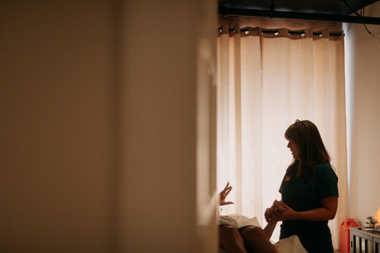 An acupuncture for anxiety success story - Maegan takes a pulse while discussing weekly updates.